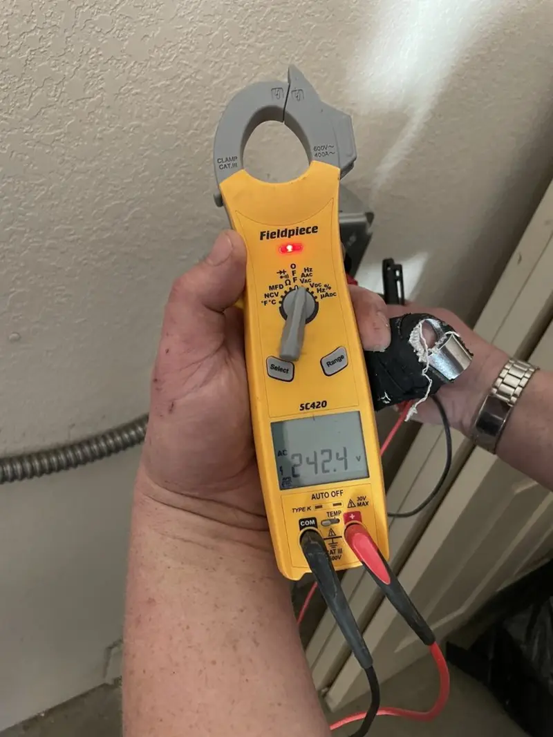 Voltage testing with clamp meter during Generator Installation in Suncoast Estates